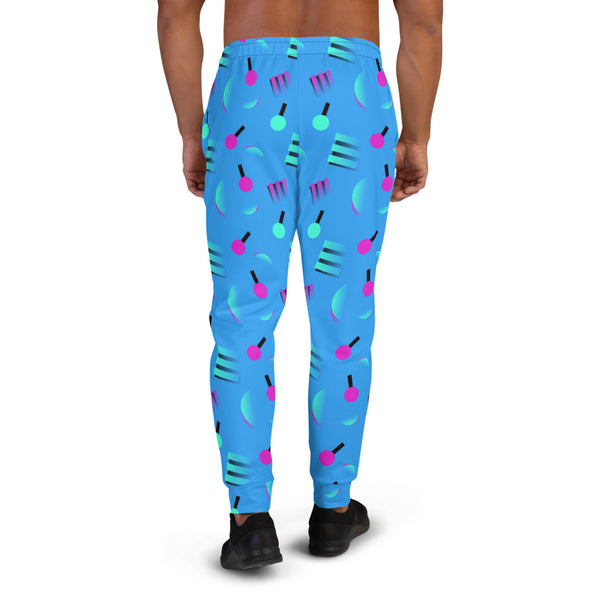 Retrowave style 80s Memphis and Vaporwave patterned men's joggers or sweats with geometric pink and turquoise shapes against a blue background on these men's running joggers or sweatpants by BillingtonPix