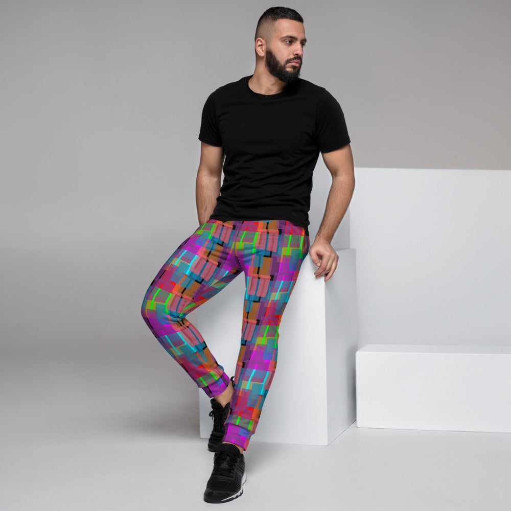 Vibrant multicoloured retro style geometric patterned joggers in turquoise, green, pink and orange shapes on a black background joggers for lounging, gym or streetwear by BillingtonPix