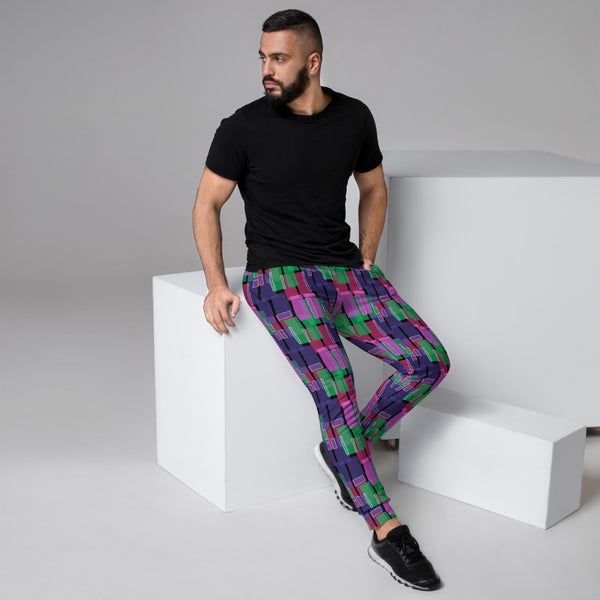 Striking retro geometric patterned joggers in purple, pink and green shapes on a black background joggers for lounging, gym or streetwear by BillingtonPix