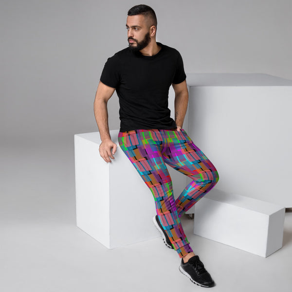 Vibrant multicoloured retro style geometric patterned joggers in turquoise, green, pink and orange shapes on a black background sweatpants for lounging, gym or streetwear by BillingtonPix