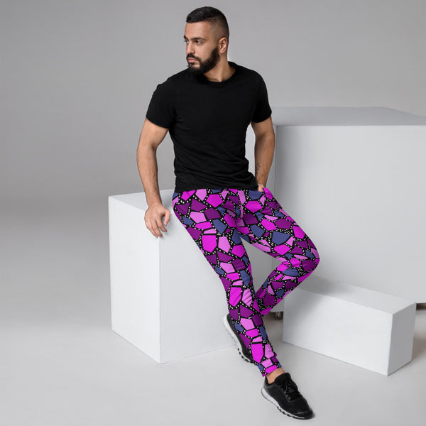 Vibrant 90s style colourful tones and geometric shapes with white dots on a black background on these cotton joggers for lounging, jogging, squatting, streetwear fashion by BillingtonPix