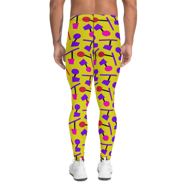 Colourful funky yellow men's leggings or running tights in an 80s Memphis style design with purple, pink and black geometric shapes on these all-over patterned meggings by BillingtonPix