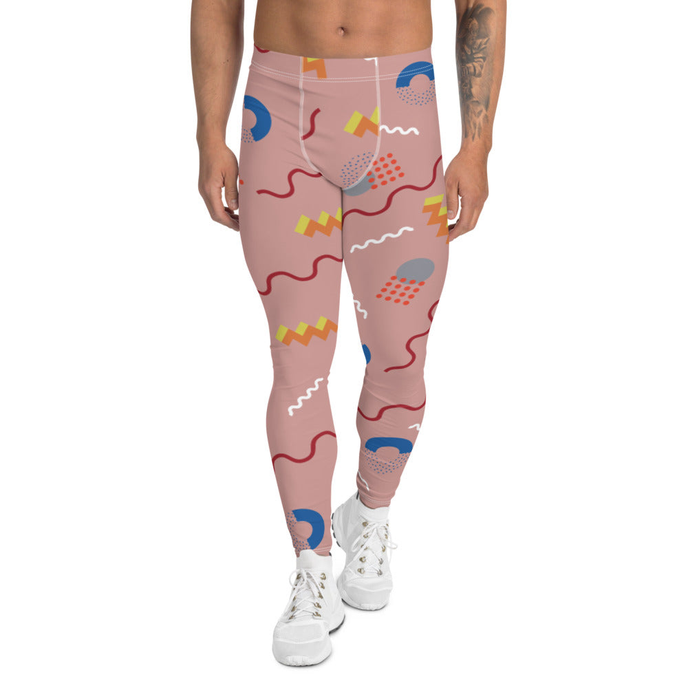 Crazy and zany 80s Memphis design patterned leggings for men or meggings consisting of geometric red, yellow, orange, blue and white shapes and squiggles against a pink background on these men's running tights by BillingtonPix