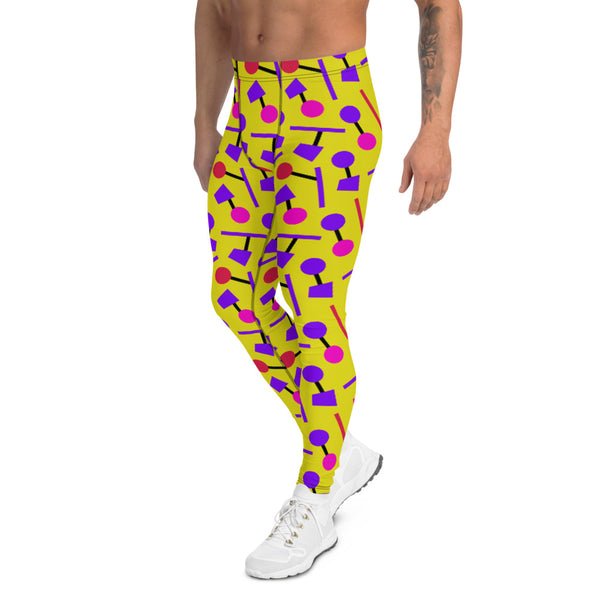 Colourful funky yellow men's leggings or running tights in an 80s Memphis style design with purple, pink and black geometric shapes on these all-over patterned meggings by BillingtonPix