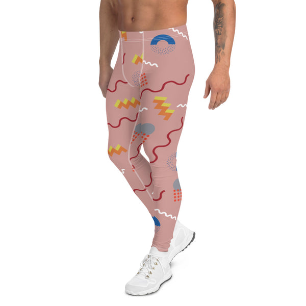 Crazy and zany 80s Memphis design patterned leggings for men or meggings consisting of geometric red, yellow, orange, blue and white shapes and squiggles against a pink background on these men's running tights by BillingtonPix