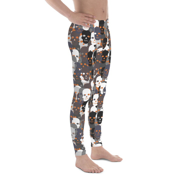 Monochrome skulls in black, white and grey against an orange background that lights up their eye sockets will make the perfect Halloween meggings this spooky season on this mens gym leggings, running and compression tights by BillingtonPix