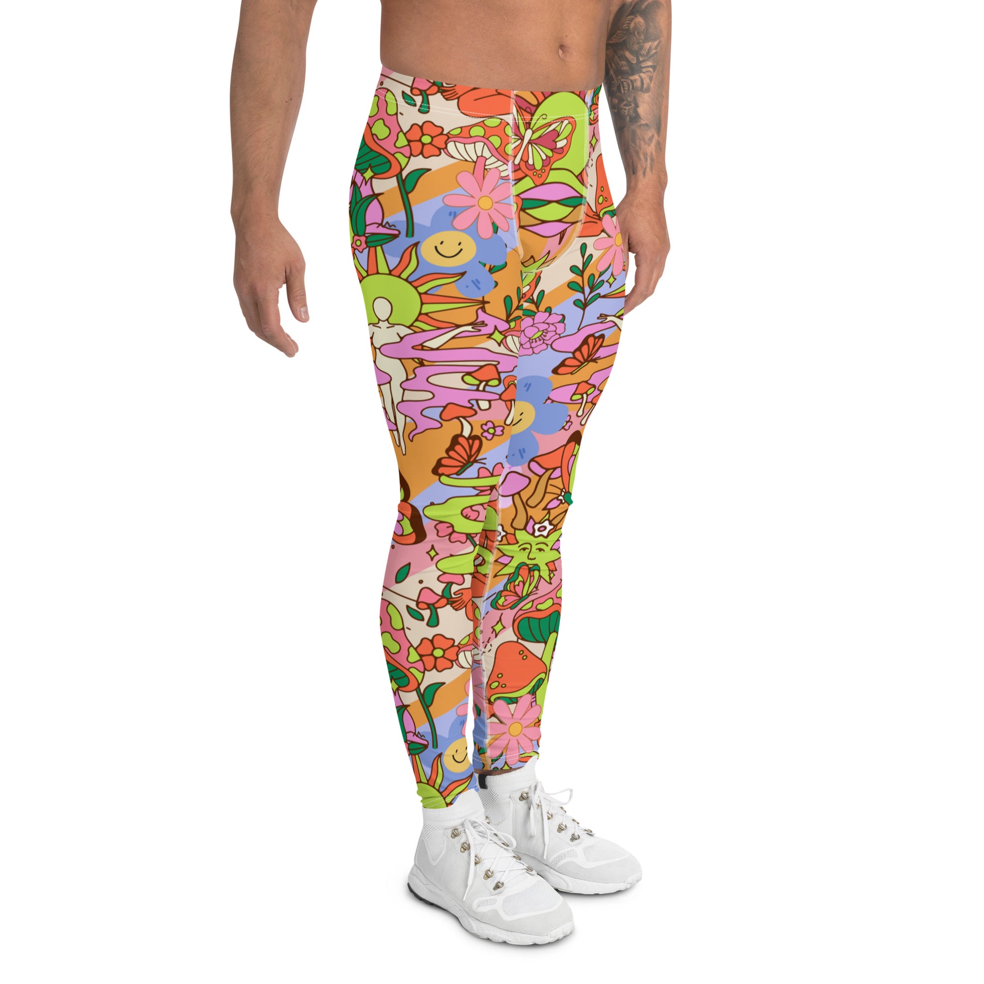 Groovy 1970s style mens leggings in a flower power floral all-over print design. Mens compression pants and running tights in orange, blue and pink spiritual design with mushrooms, butterflies, buddha, flowers and smiley faces. Kawaii cutecore meggs for gym, festivals and clubbing