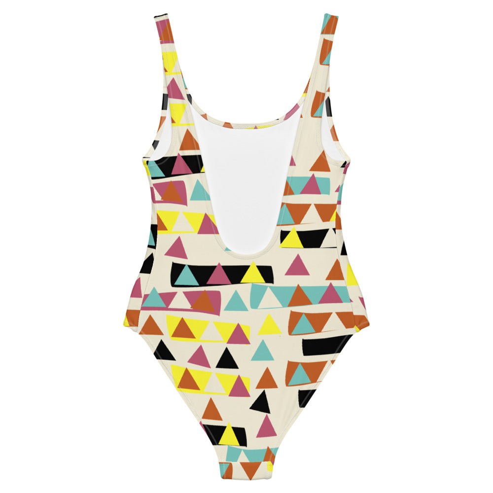 This cheeky, stylish and comfortable, abstract design patterned swimsuit is entitled Triangular Forest and consists of a colorful, abstract triangles within blocks of color and against a cream background