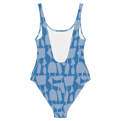 This cheeky, stylish and comfortable, abstract design patterned swimsuit is entitled Forever Connected and consists of a colorful, abstract shapes, connected by vertical lines, against a French blue background