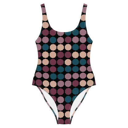 This cheeky, stylish and comfortable, abstract design patterned one-piece swimsuit is entitled Vintage Dot Matrix and consists of a colorful, abstract polka dots against a black background