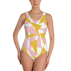 One piece UK designed swimming costume with pink and mustard triangular pattern on a white background by BillingtonPix