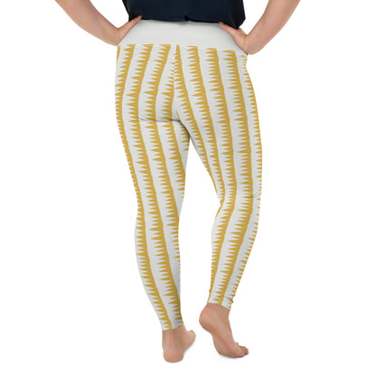 This Mid-Century Modern style plus size leggings pattern consists of colorful mustard yellow jagged columns of geometric triangular shapes stacked upon each other like columns against a pale cream background