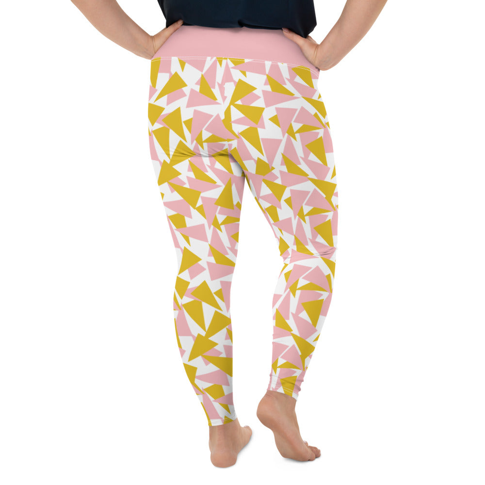 This Mid-Century Modern style plus size leggings pattern consists of colorful triangle shapes in pink and orange on a white background. The high waistband is in a soft pink colour