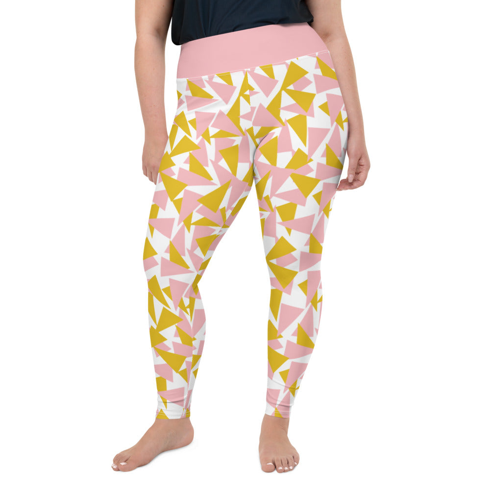This Mid-Century Modern style plus size leggings pattern consists of colorful triangle shapes in pink and orange on a white background. The high waistband is in a soft pink colour