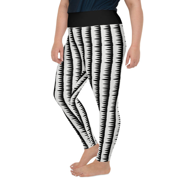 These Mid-Century Modern style plus size leggings pattern consists of black jagged columns of geometric triangular shapes stacked upon each other like columns against a pale cream background. A black high waistband completes the look.