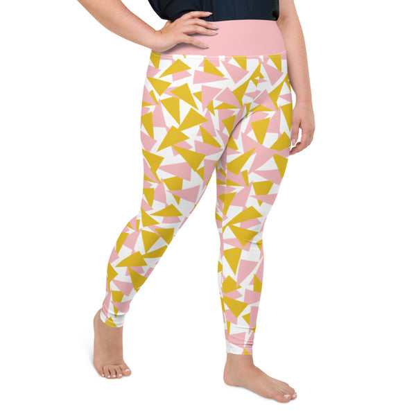 This Mid-Century Modern style plus size leggings pattern consists of colorful triangle shapes in pink and orange on a white background. The high waistband is in a soft pink colour