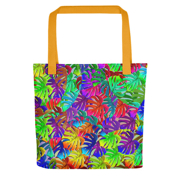 Rainbow colored pattern of circular overlays containing different tones of monstera leaves. Bright, bold and fun and teeming with 80s Memphis style influence on this tote bag.