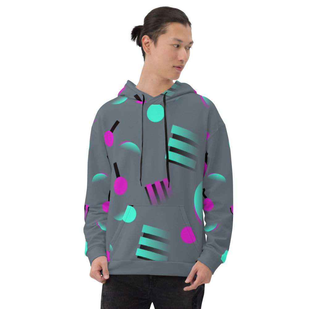 Colourful grey hoodie with an 80s Memphis and 90s Vaporwave inspired geometric pattern, consisting of large circular and square shapes in pink and mint against a blue background on this hoodie pullover by BillingtonPix