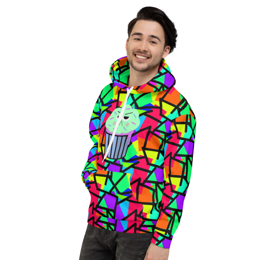 Geometric 80s pattern in multicoloured geometric shapes including red, purple, yellow, green and orange with a corresponding black geometric pattern outline overlay. Featuring a grumpy mint and mauve coloured cupcake with sprinkles on the front of this unisex printed hoodie by BillingtonPix