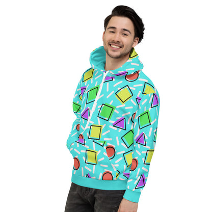 Retro style 80s Memphis design hoodie pullover with colourful rainbow primary colors in geometric shapes squares, circles. triangles with a random white pattern below all over a turquoise blue background on this best athleisure relaxed fit hoodie by BillingtonPix