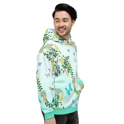 Vaporwave Cottagecore mashup design with a floral and butterfly pattern in rainbow colours against a turquoise blue fade background on this unisex hoodie by BillingtonPix