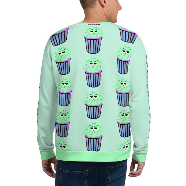 Kawaii 90s style green, blue and pink graphic with a grumpy cupcake pattern with mint icing  and the Japanese words イライラするカップケーキ on each arm of this cute Harajuku sweatshirt pullover by BillingtonPix