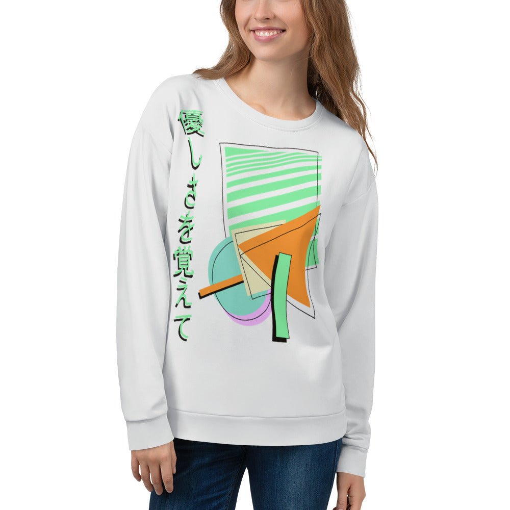 Retro style 90s Vaporwave and 80s Memphis fusion in this sweatshirt design by BillingtonPix, featuring geometric shapes in tones of orange, green, blue and mauve with black line shadow overlays. Japanese phrase 優しさを覚えて is written vertically down the left hand side all against a pale grey background to provide a sharp streetwear visual.