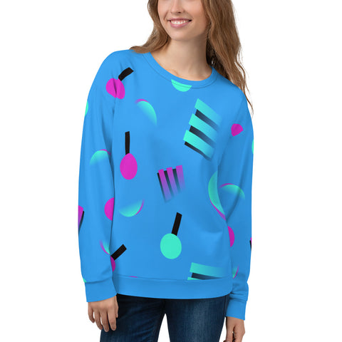 Colourful blue sweatshirt with an 80s inspired geometric pattern, consisting of large circular and square shapes in pink and mint against a blue background on this sweatshirt pullover by BillingtonPix