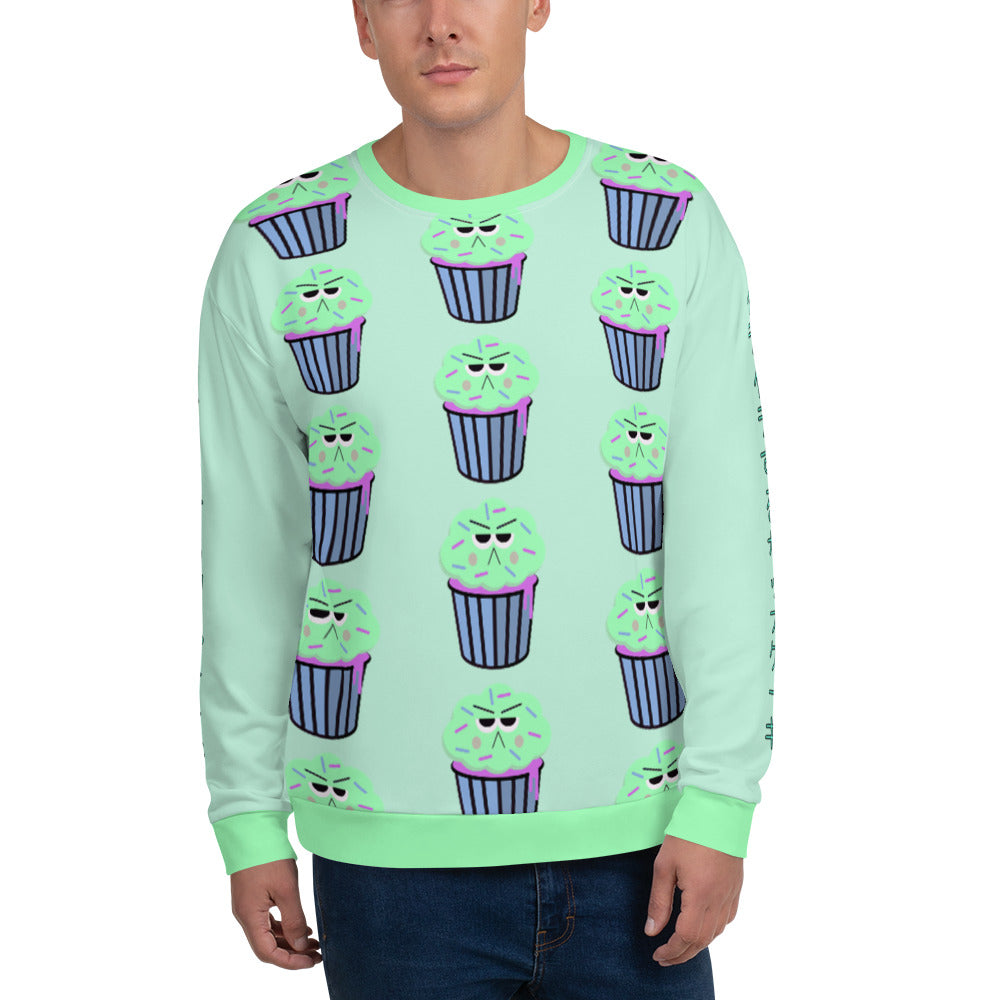 Kawaii 90s style green, blue and pink graphic with a grumpy cupcake pattern with mint icing  and the Japanese words イライラするカップケーキ on each arm of this cute Harajuku sweatshirt pullover by BillingtonPix