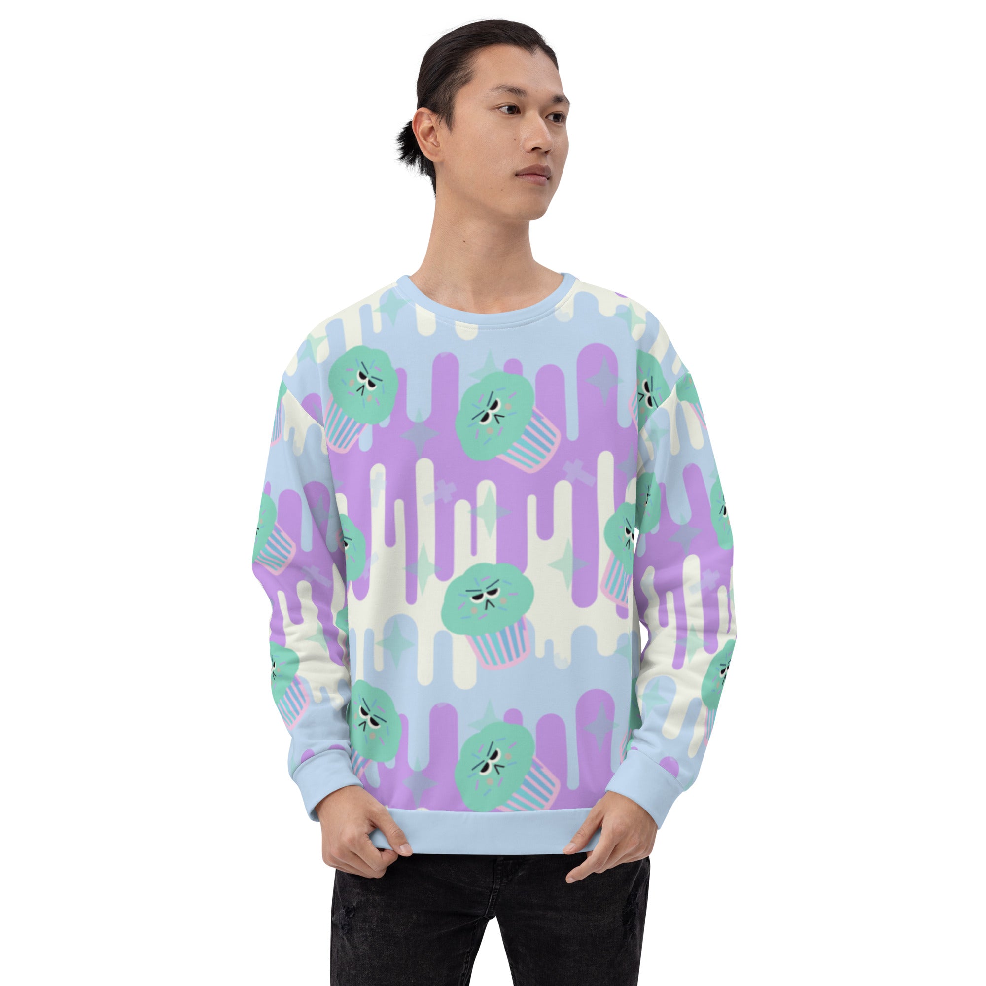 Fairy Kei sweater in Japanese Harajuku style with green frosted cupcakes against a drip background in pastel tones of blue, purple and cream and with translucent sprinkles of confetti on this unisex sweatshirt by BillingtonPix