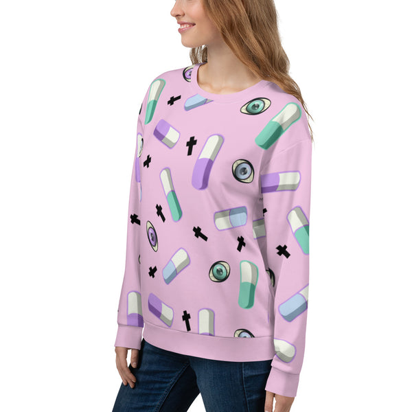 Pink Yami Kawaii clothing with Menhere Kei symbols of pills, crosses and colourful eyeballs provide a juxtaposition of cute with darker symbols on this pink Harajuku sweatshirt or sweater by BillingtonPix