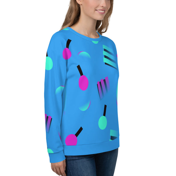 Colourful blue sweatshirt with an 80s inspired geometric pattern, consisting of large circular and square shapes in pink and mint against a blue background on this sweatshirt pullover by BillingtonPix