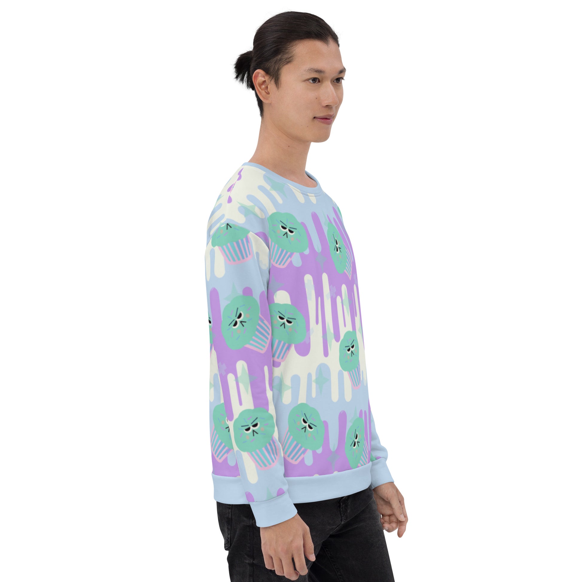 Fairy Kei sweater in Japanese Harajuku style with green frosted cupcakes against a drip background in pastel tones of blue, purple and cream and with translucent sprinkles of confetti on this unisex sweatshirt by BillingtonPix