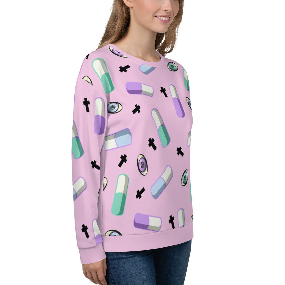 Pink Yami Kawaii clothing with Menhere Kei symbols of pills, crosses and colourful eyeballs provide a juxtaposition of cute with darker symbols on this pink Harajuku sweatshirt or sweater by BillingtonPix