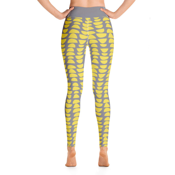 The patterned retro Mid Century Modern style design has stacked abstract shapes alternating in reverse against a stunning grey background. The waistband is kept simple, extending the gray background color of these distinctive patterned yoga tights
