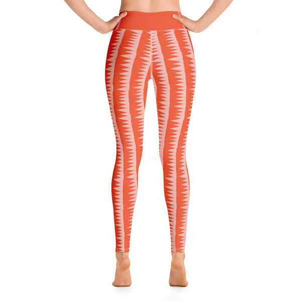 This Mid-Century Modern style yoga leggings pattern consists of colorful pink jagged columns of geometric triangular shapes stacked upon each other like columns against an orange red background. The high waistband is kept simple, picking out the vibrant orange color in these distinctive patterned yoga tights.