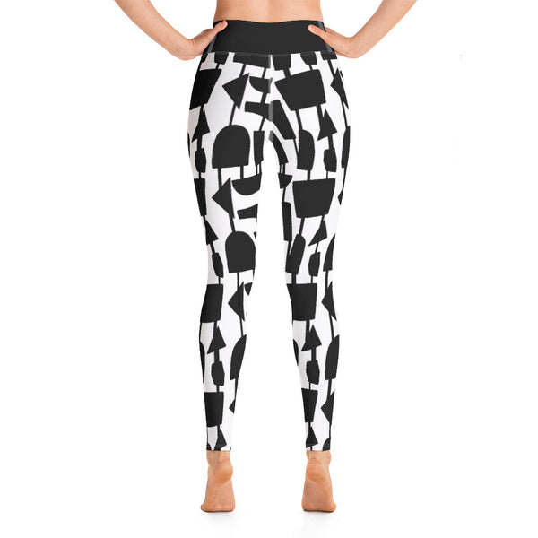 This Midcentury Modern style black and white yoga leggings pattern consists of black irregular abstract shapes connected vertically by black strings against a white background with a high waistband and inside pocket