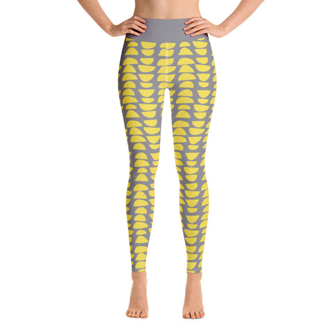 The patterned retro Mid Century Modern style design has stacked abstract shapes alternating in reverse against a stunning grey background. The waistband is kept simple, extending the gray background color of these distinctive patterned yoga tights