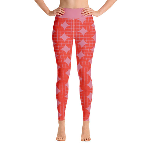These Mid-Century Modern style yoga leggings consists of a mosaic pattern of orange abstract geometric shapes of descending serpents against pink background. The high waistband is kept simple, picking out the pink colour in these distinctive patterned yoga tights