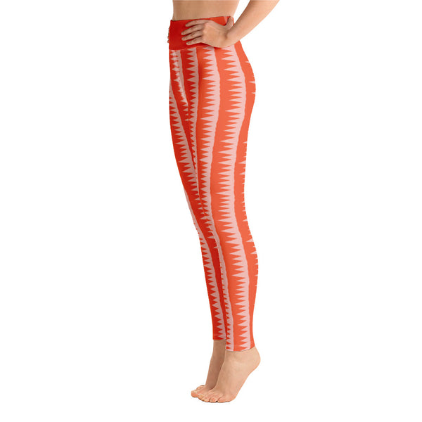 This Mid-Century Modern style yoga leggings pattern consists of colorful pink jagged columns of geometric triangular shapes stacked upon each other like columns against an orange red background. The high waistband is kept simple, picking out the vibrant orange color in these distinctive patterned yoga tights.