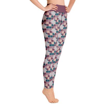 These Mid-Century Modern style yoga leggings consists of a mosaic pattern of burgundy, teal, pink and cream in the abstract shape of descending serpents against pale grey background. The high waistband is kept simple, picking out the burgundy colour in these distinctive patterned yoga tights