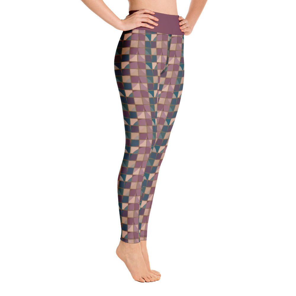 These yoga leggings consist of a mosaic pattern of abstract geometric shapes in purple and teal providing an almost gothic feel