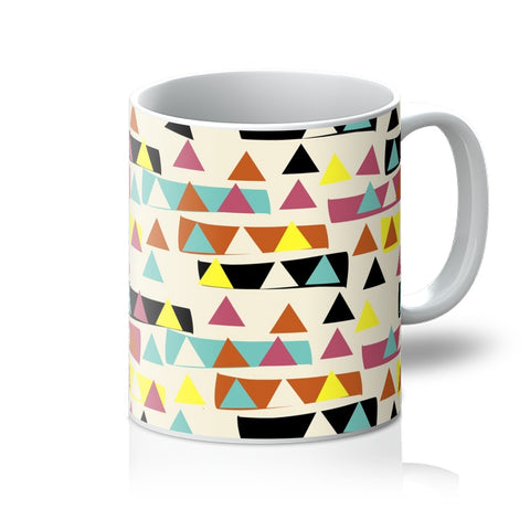 This Mid-Century Modern style mug consists of a colorful, abstract geometric triangle patterned design with blocks of color