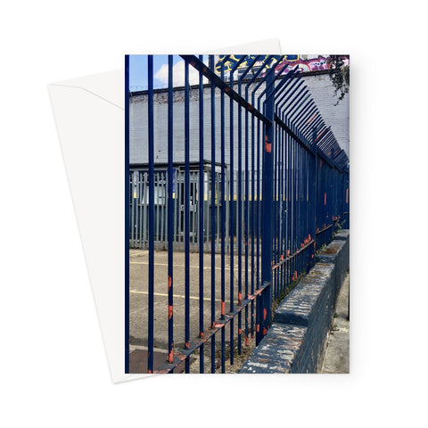 Blue railings with flaking paint revealing orange colour beneath, viewed along a side perspective in this urban greeting card