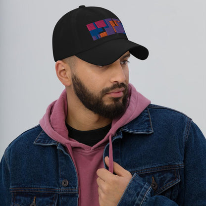 Colorful pink, orange, purple and blue geometric shapes patterned rectangular logo on this black colored dad hat