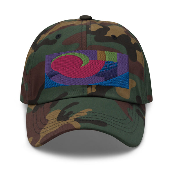 Green camo dad hat with colorful rectangular logo containing blocks of colors of pink, purple, green and blue, curves and geometric shapes in a mid-century modernist abstract composition