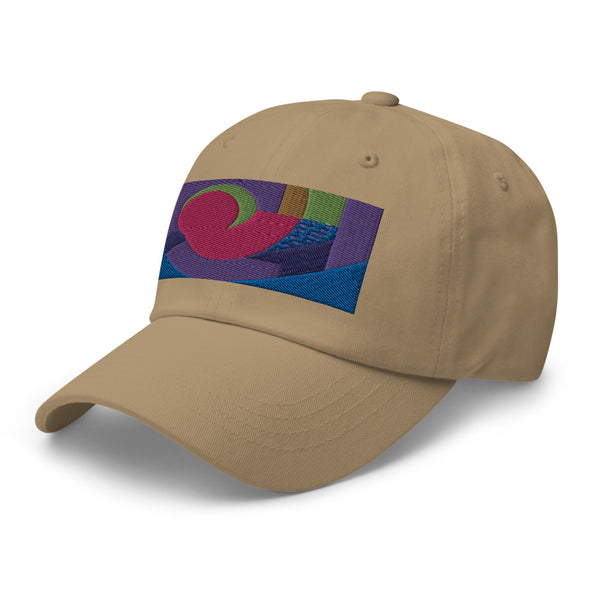 khaki dad hat with colorful rectangular logo containing blocks of colors of pink, purple, green and blue, curves and geometric shapes in a mid-century modernist abstract composition