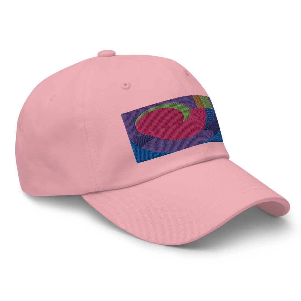 Pink dad hat with colorful rectangular logo containing blocks of colors of pink, purple, green and blue, curves and geometric shapes in a mid-century modernist abstract composition