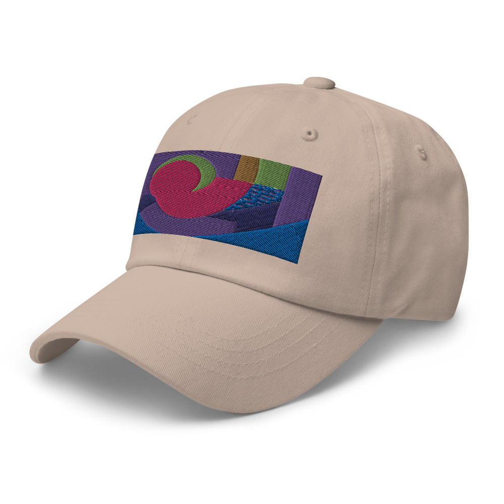 stone dad hat with colorful rectangular logo containing blocks of colors of pink, purple, green and blue, curves and geometric shapes in a mid-century modernist abstract composition