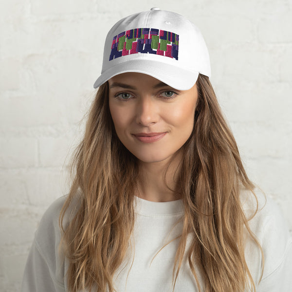 White colored dad hat with retro 60s style geometric pattern logo in threads of lime green, pink, purple and indigo